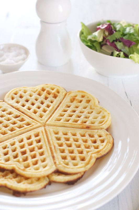 savoury waffles on white plate with salad