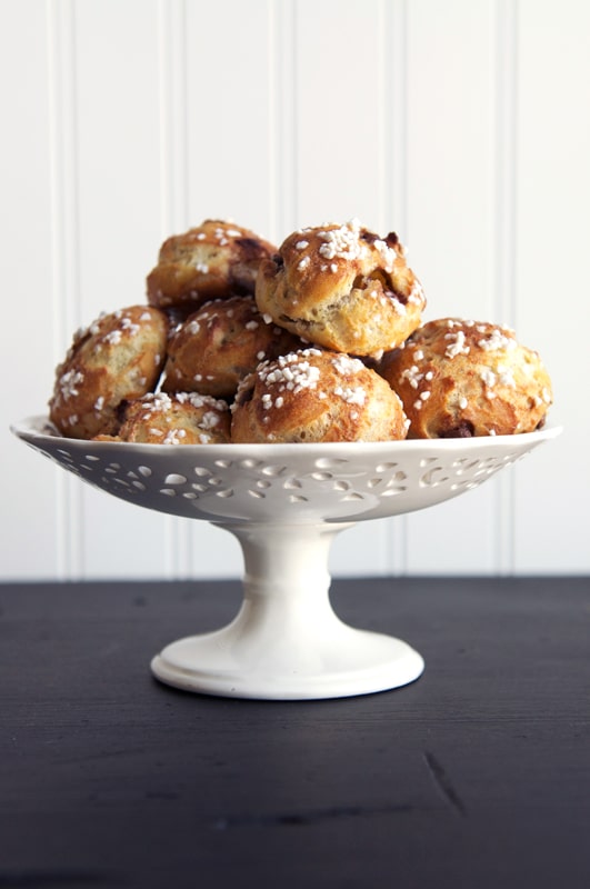 chocolate chip chouquettes on cake stand