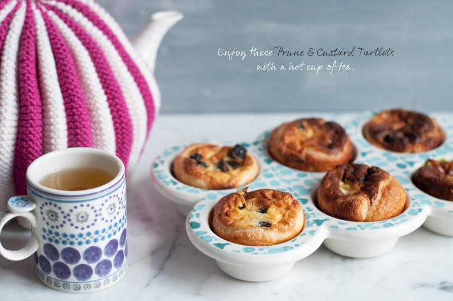 custard tarts with cup of tea