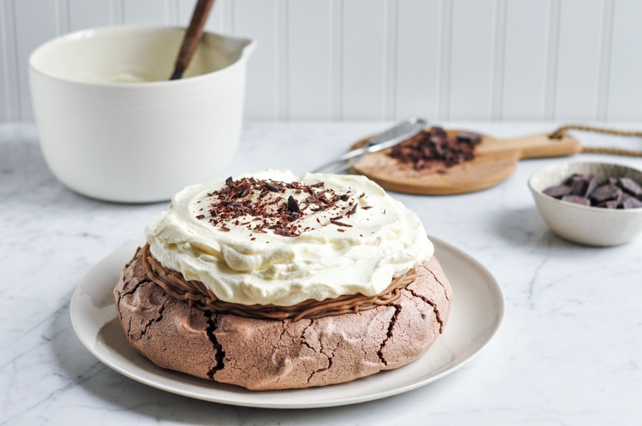 mont blanc chocolate pavlova with whipped cream and shaved chocolate