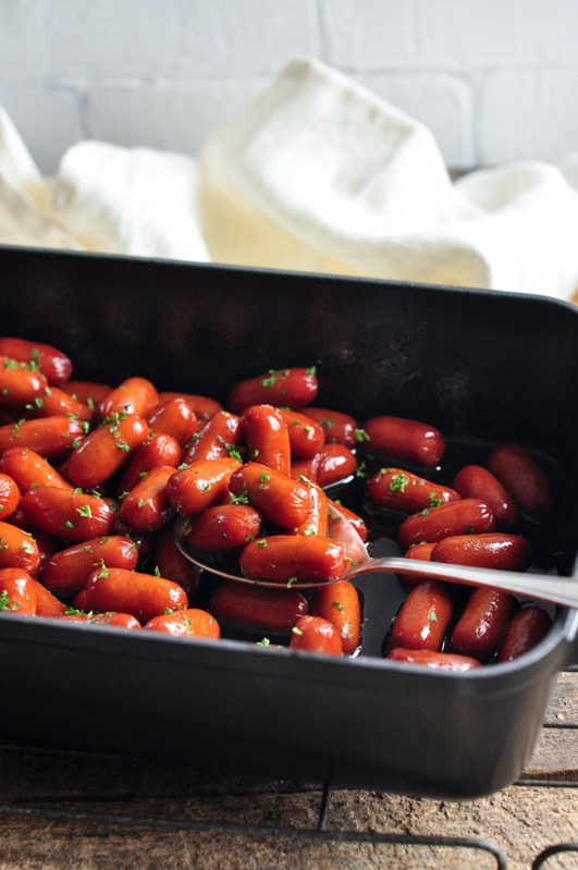 honey soy sriracha cocktail sausages in roasting tray