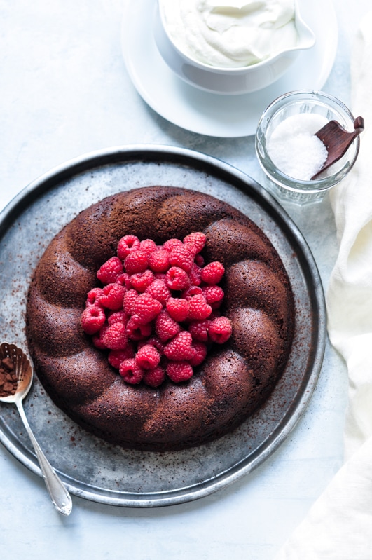salted butter chocolate cake topped with raspberries