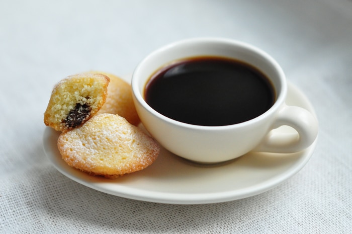 madeleines with nutella on saucer with coffee cup