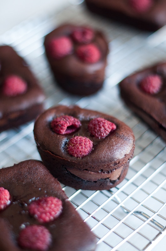 gooey chocolate cakes with nutella and topped with raspberries