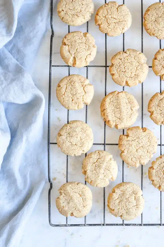 tahini cookies on wire rack on marble table