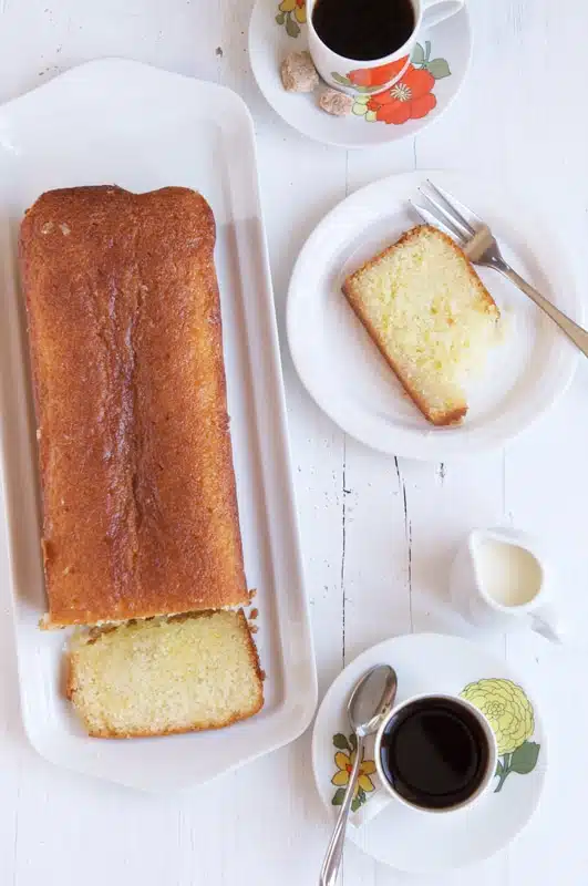 lemon syrup cake sliced on plate