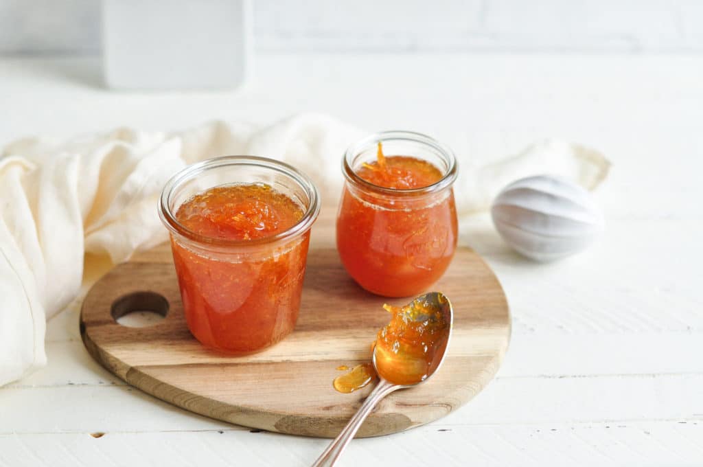 glass jars filled with orange marmalade