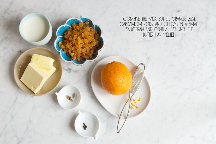 butter, milk, raisins, orange zest, cardamom pods and cloves on small plates