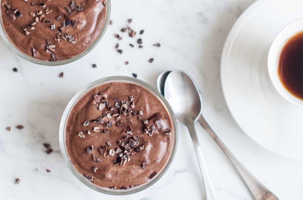 chocolate mousse with cocoa nibs in small bowls