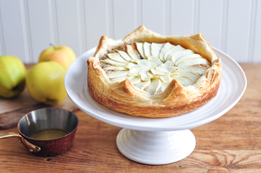 galette des rois with apples on cake stand