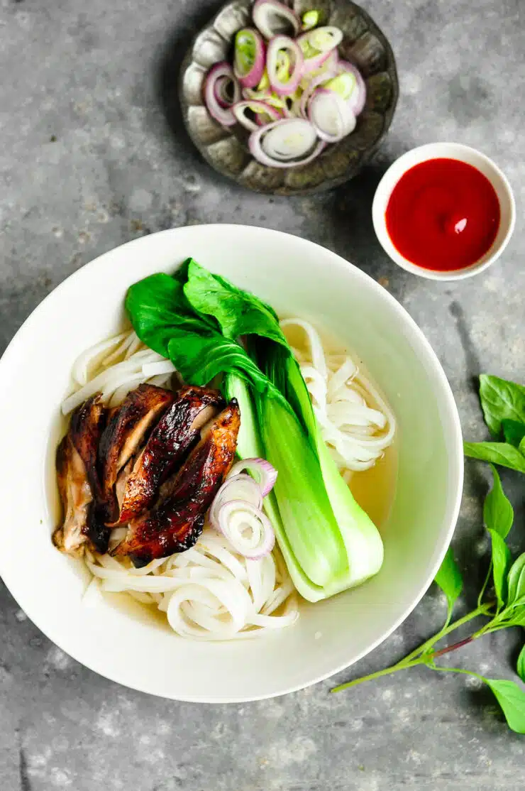 sticky chicken pho with bok choy in noodle bowl