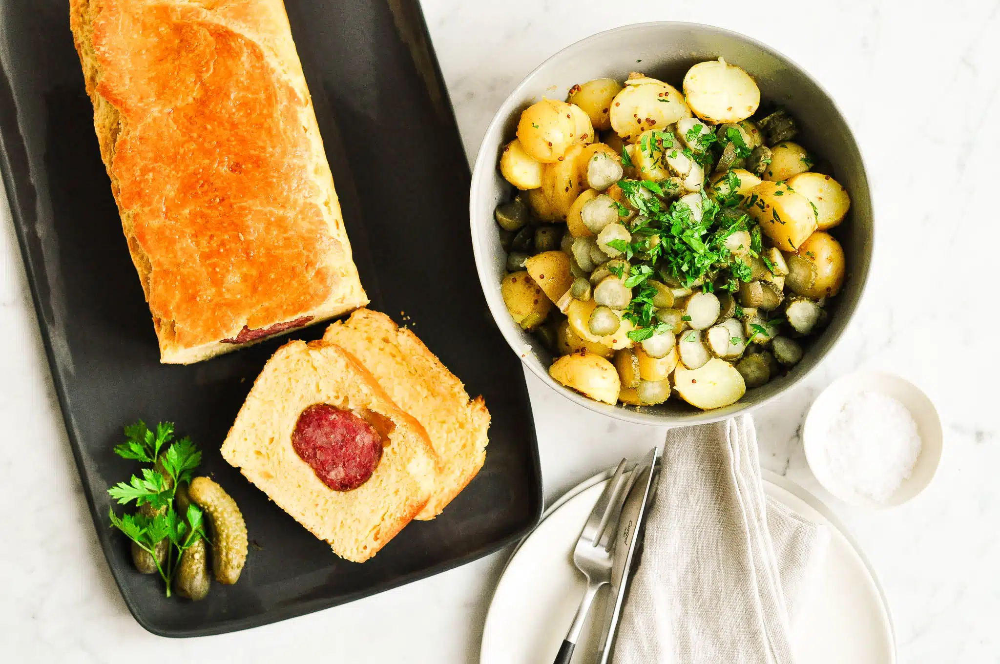 lyonnaise sausage roll with potato salad
