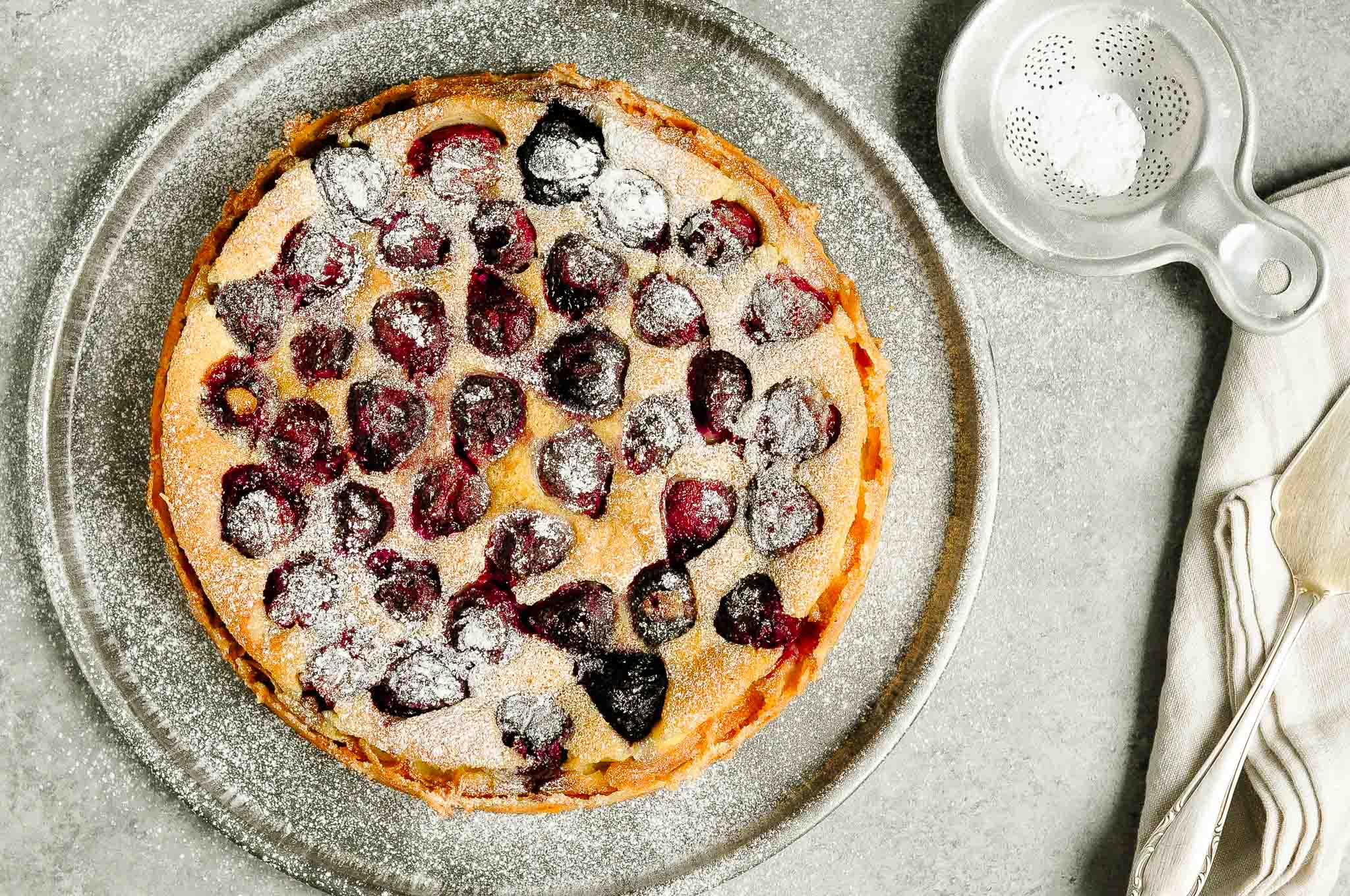 cherry clafoutis with powdered sugar