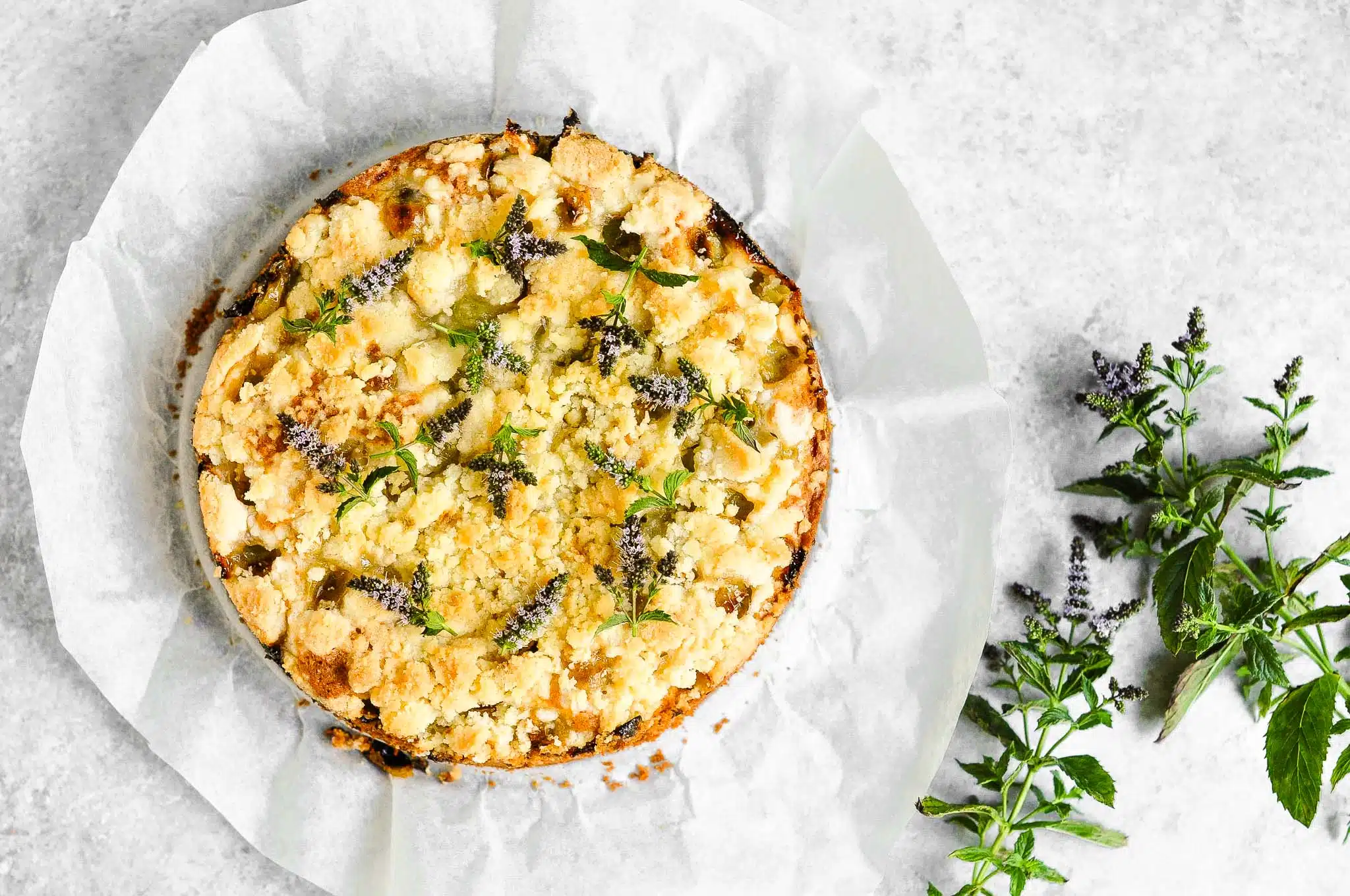 gooseberry crumble cake with mint flowers