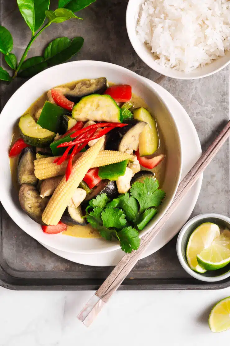 thai green curry with vegetables in bowl with rice