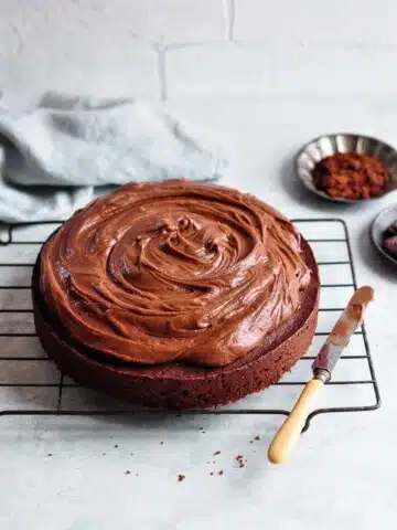 easy chocolate cake on vintage wire rack with vintage cake knife