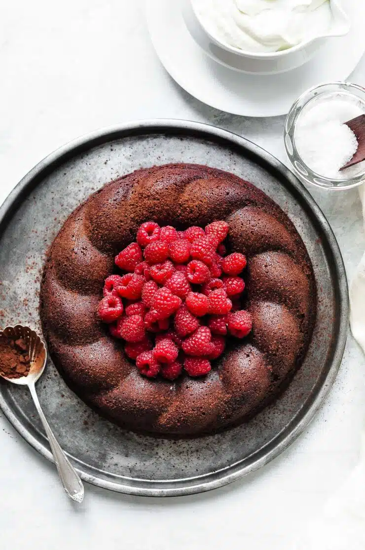 salted butter chocolate cake topped with raspberries