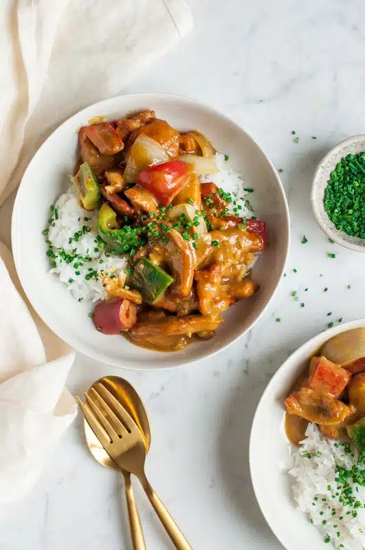 satay chicken stir fry with rice on marble table