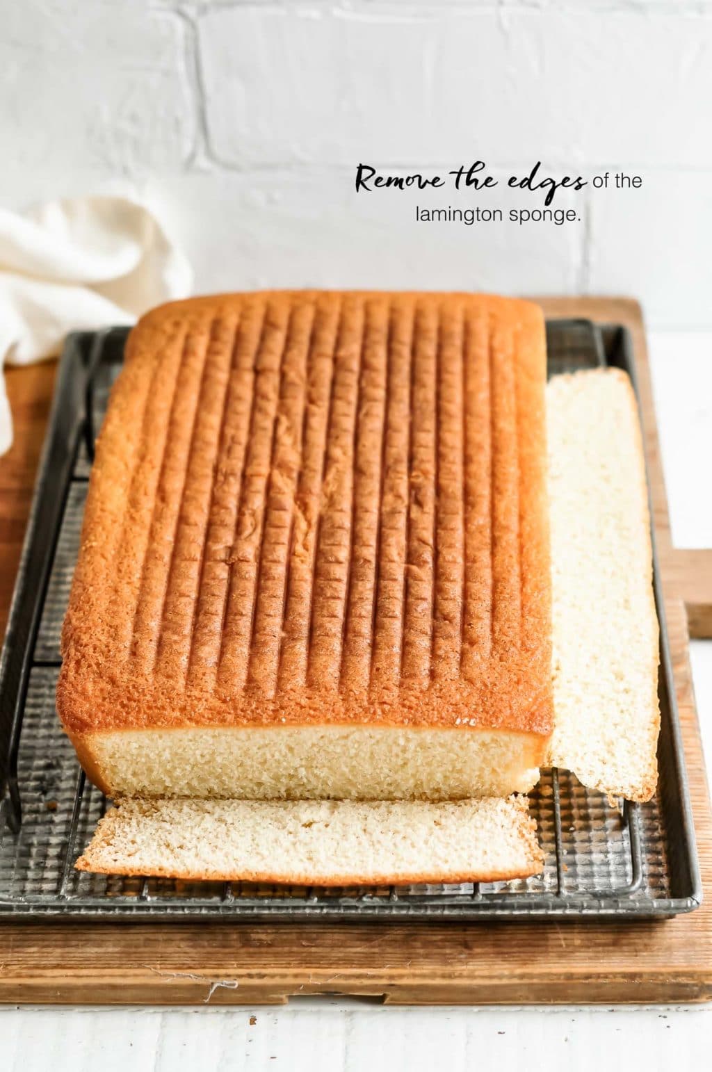 how to make lamingtons, remove the edges from the lamington sponge