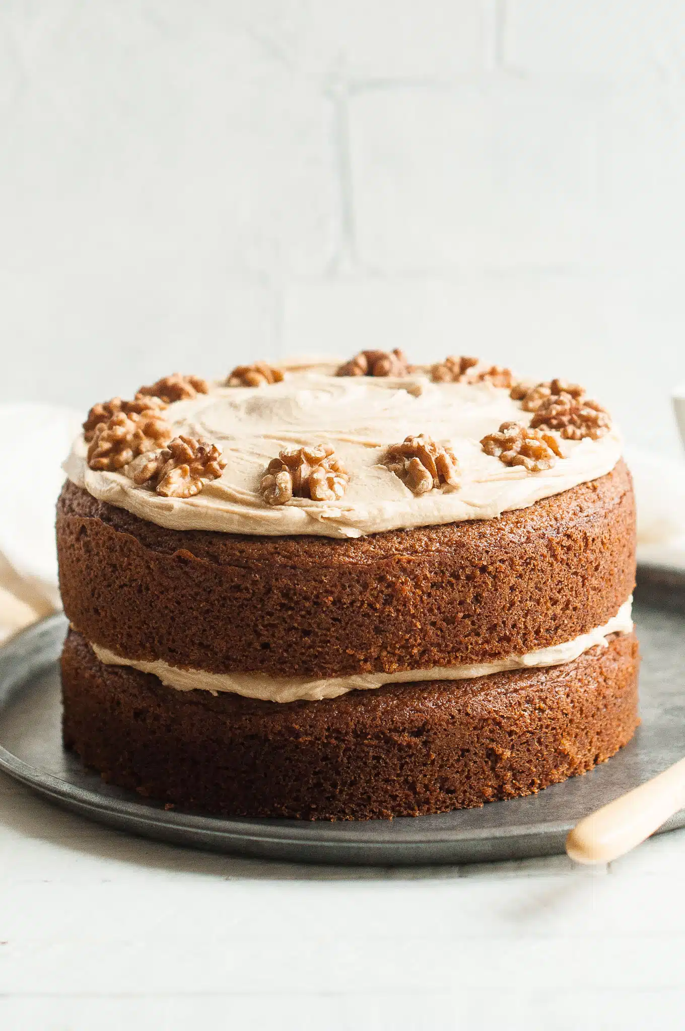 coffee and walnut cake on metal tray