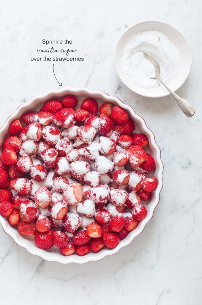 how to make strawberry cobbler, sprinkle sugar on top of the strawberries