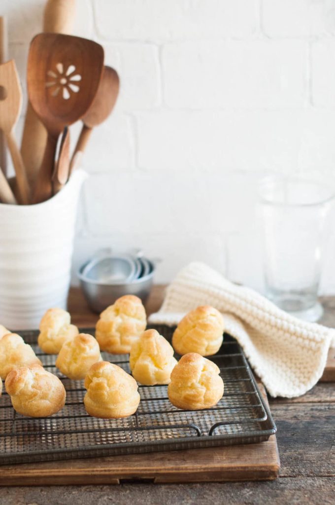 how to make choux pastry, choux pastry buns on wire rack on metal tray