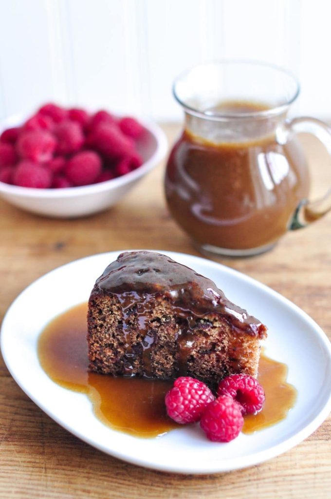 slice of sticky toffee pudding or sticky date pudding drizzled with butterscotch sauce