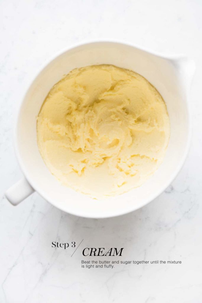 creamed butter and sugar in white mixing bowl