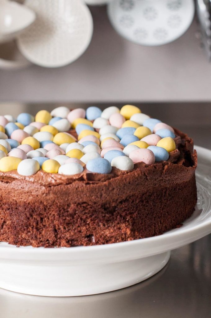 chocolate easter cake on white cake stand