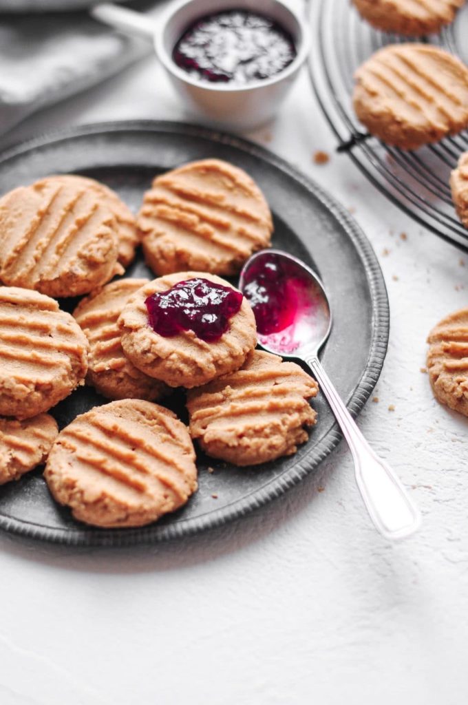 peanut butter cookies with dollop of raspberry jam