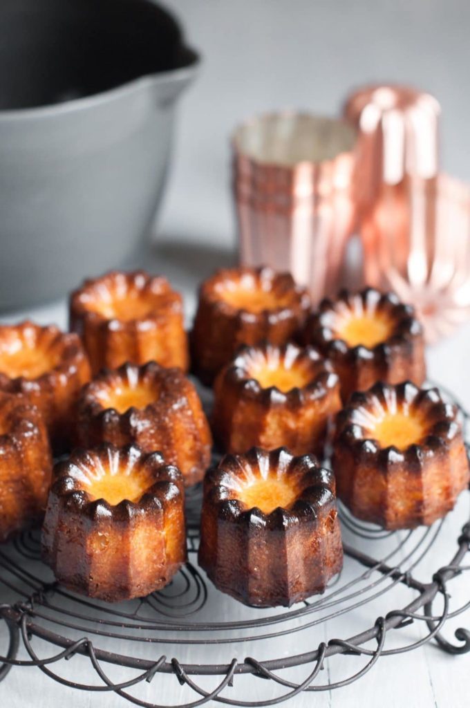 canneles on wire rack with copper cannele moulds