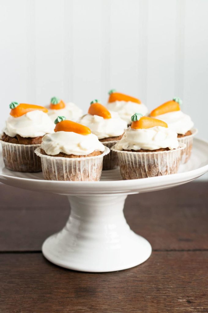 carrot cupcakes cream cheese frosting on cake stand