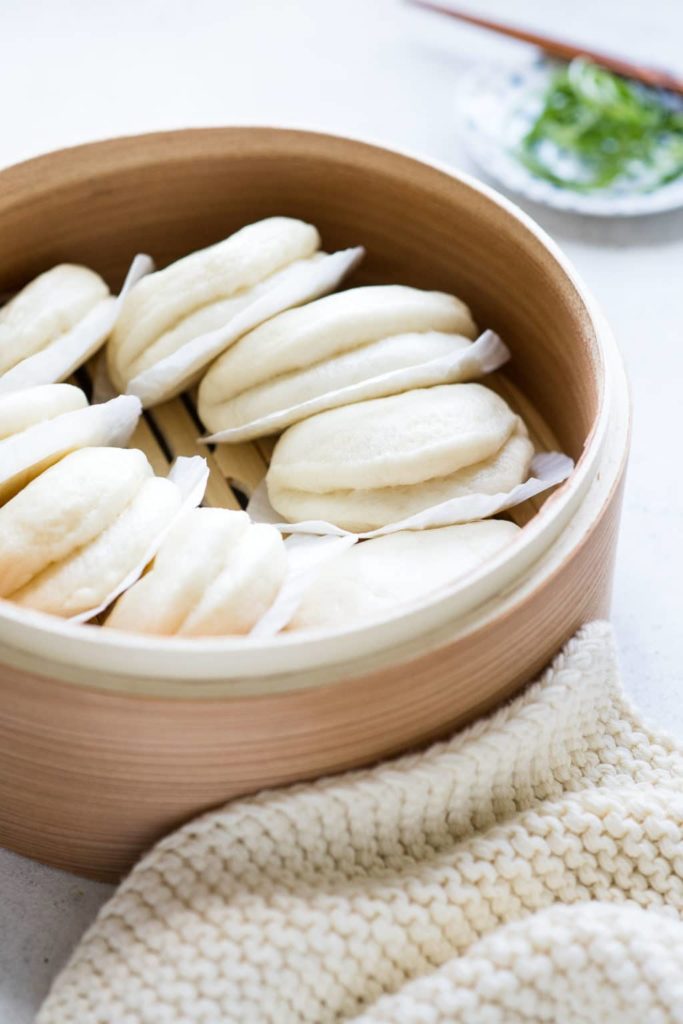 bao buns in chinese steamer basket