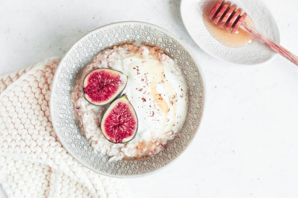 bowl of overnight oats or bircher muesli with fresh figs and honey