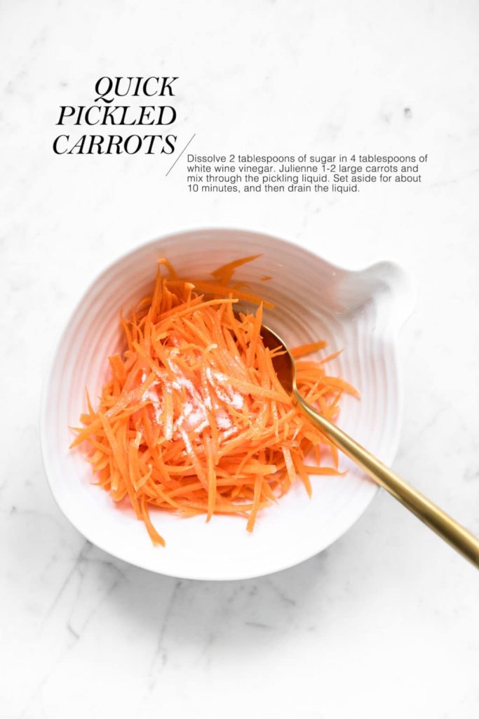 shredded carrots in white bowl