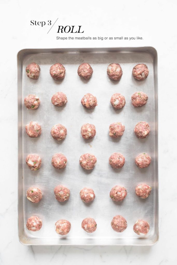 uncooked swedish meatballs on sheet pan