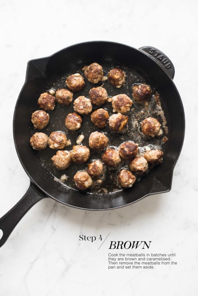 swedish meatballs cooked in oil in skillet