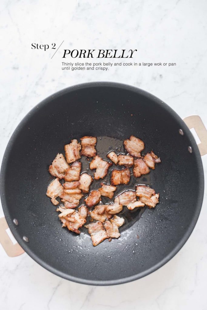 stir-fried pork belly in wok