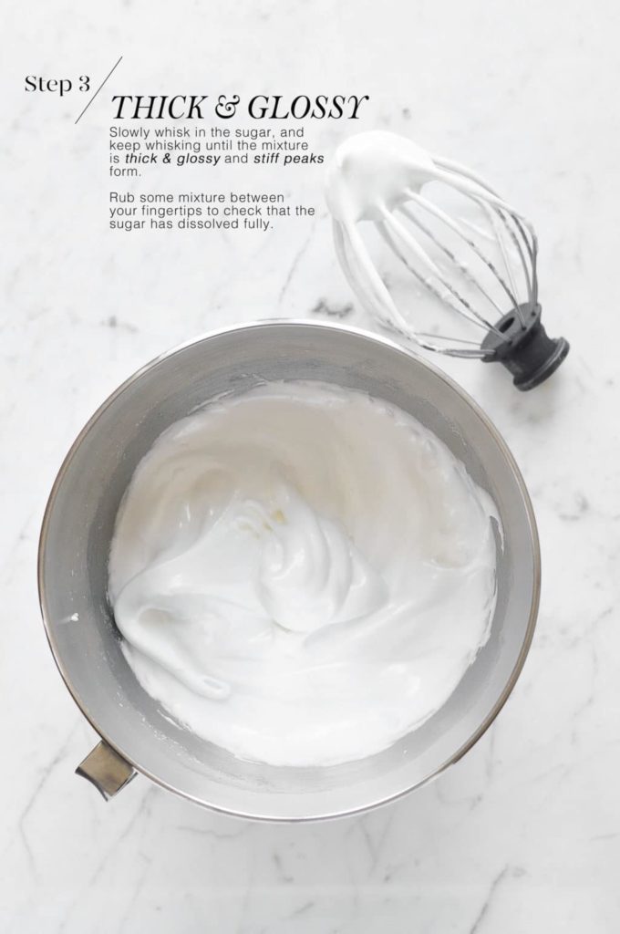 pavlova mixture in mixing bowl with whisk