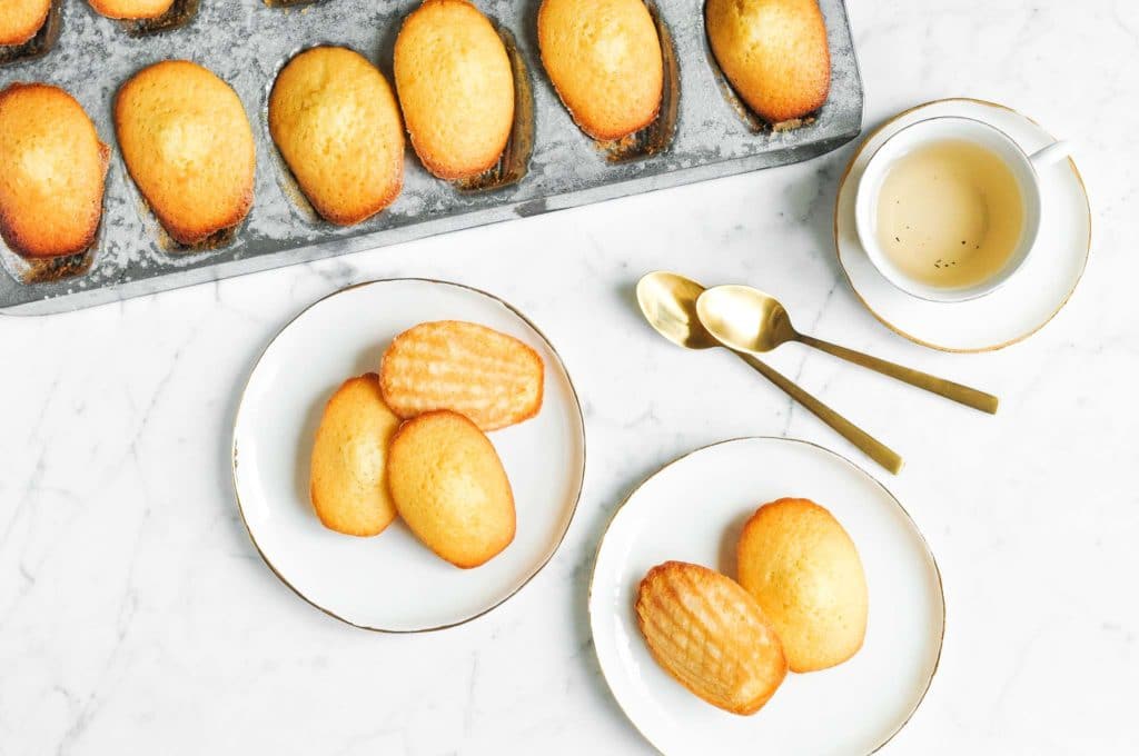 french madeleines on white plates