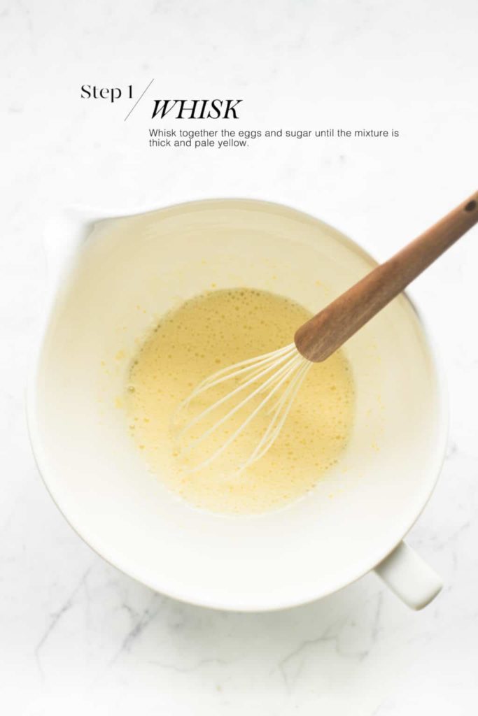 whisked eggs and sugar in white mixing bowl