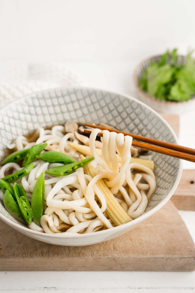 udon noodle soup with wooden chopsticks