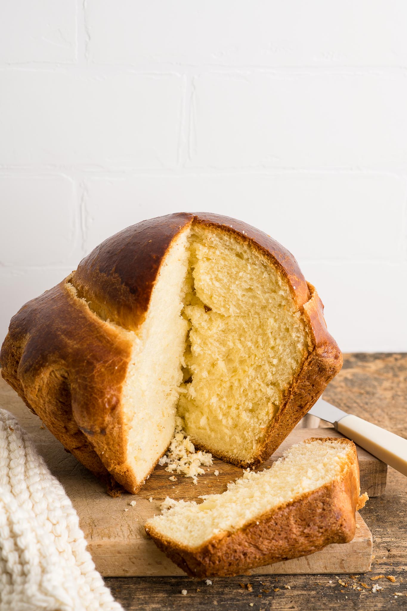 brioche bread sliced open on wooden board