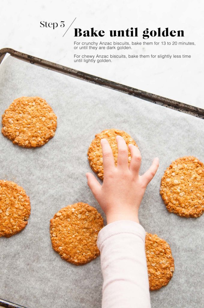 baked anzac biscuits on baking tray