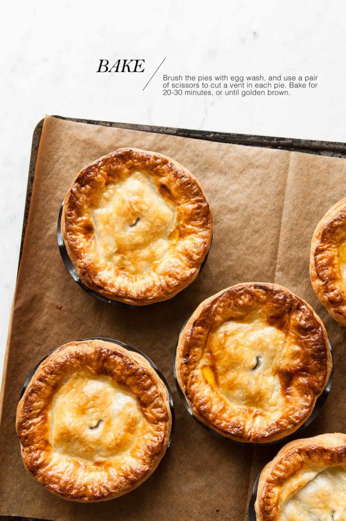 golden brown meat pies on baking tray