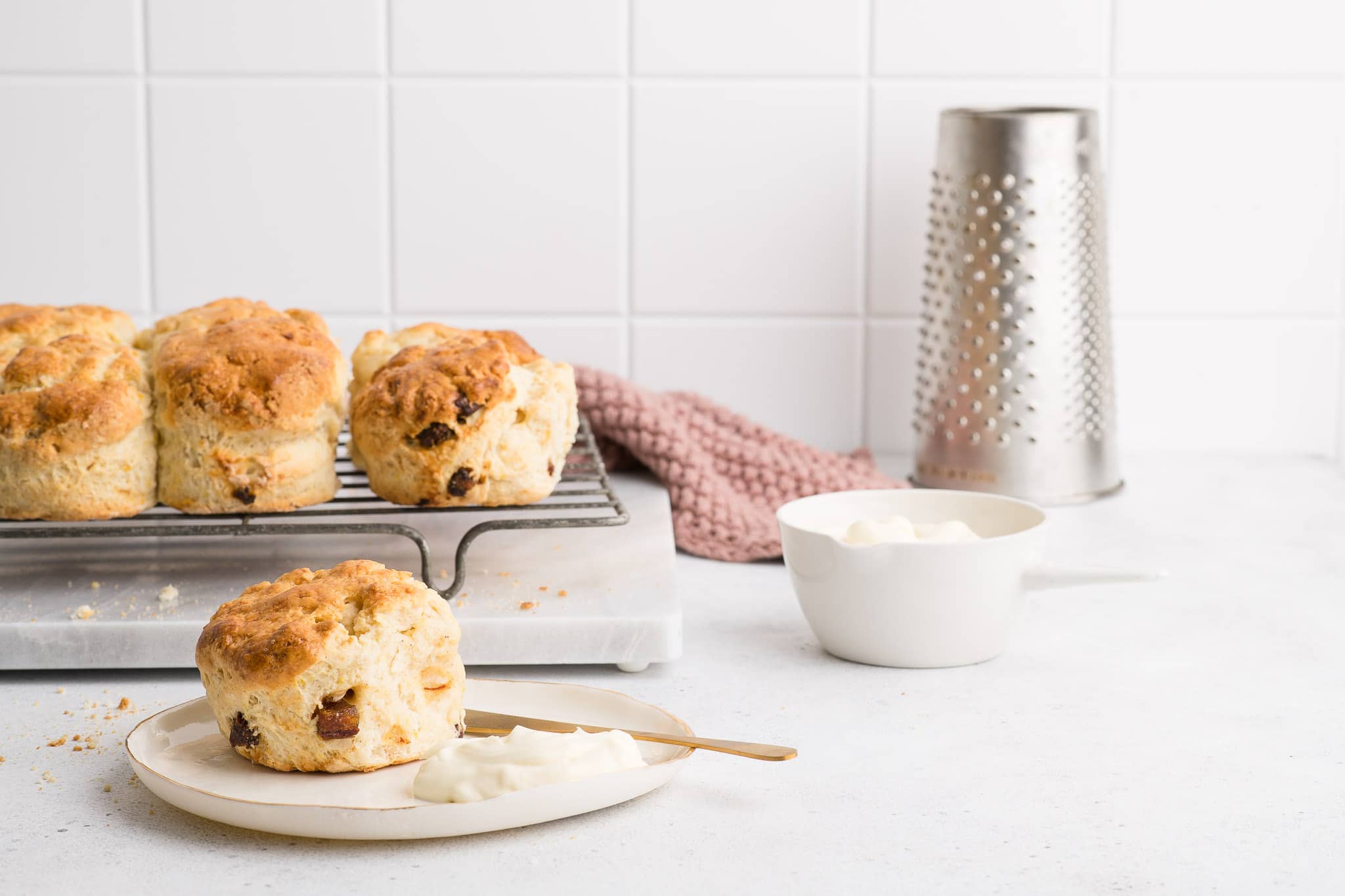 date scones on plate with clotted cream