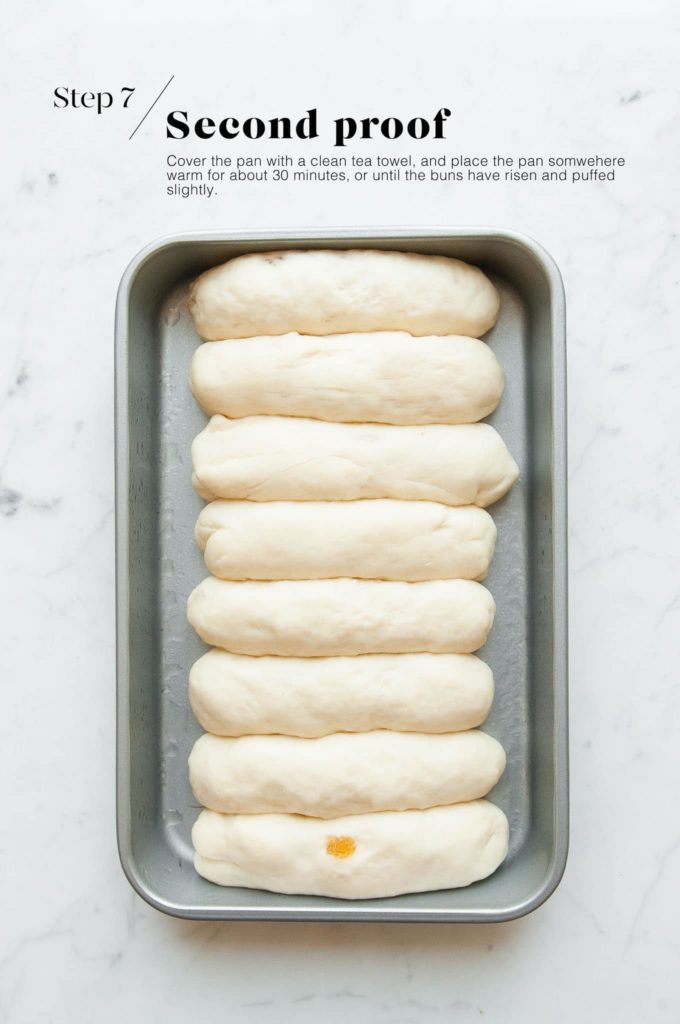 risen finger bun dough in baking pan
