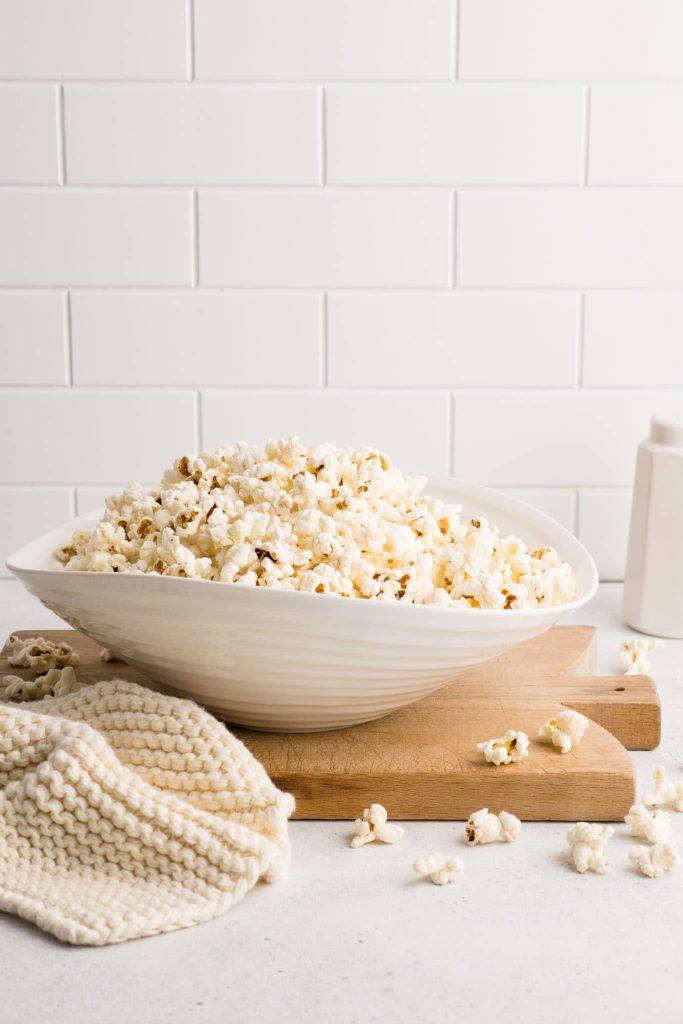 white serving bowl filled with popcorn