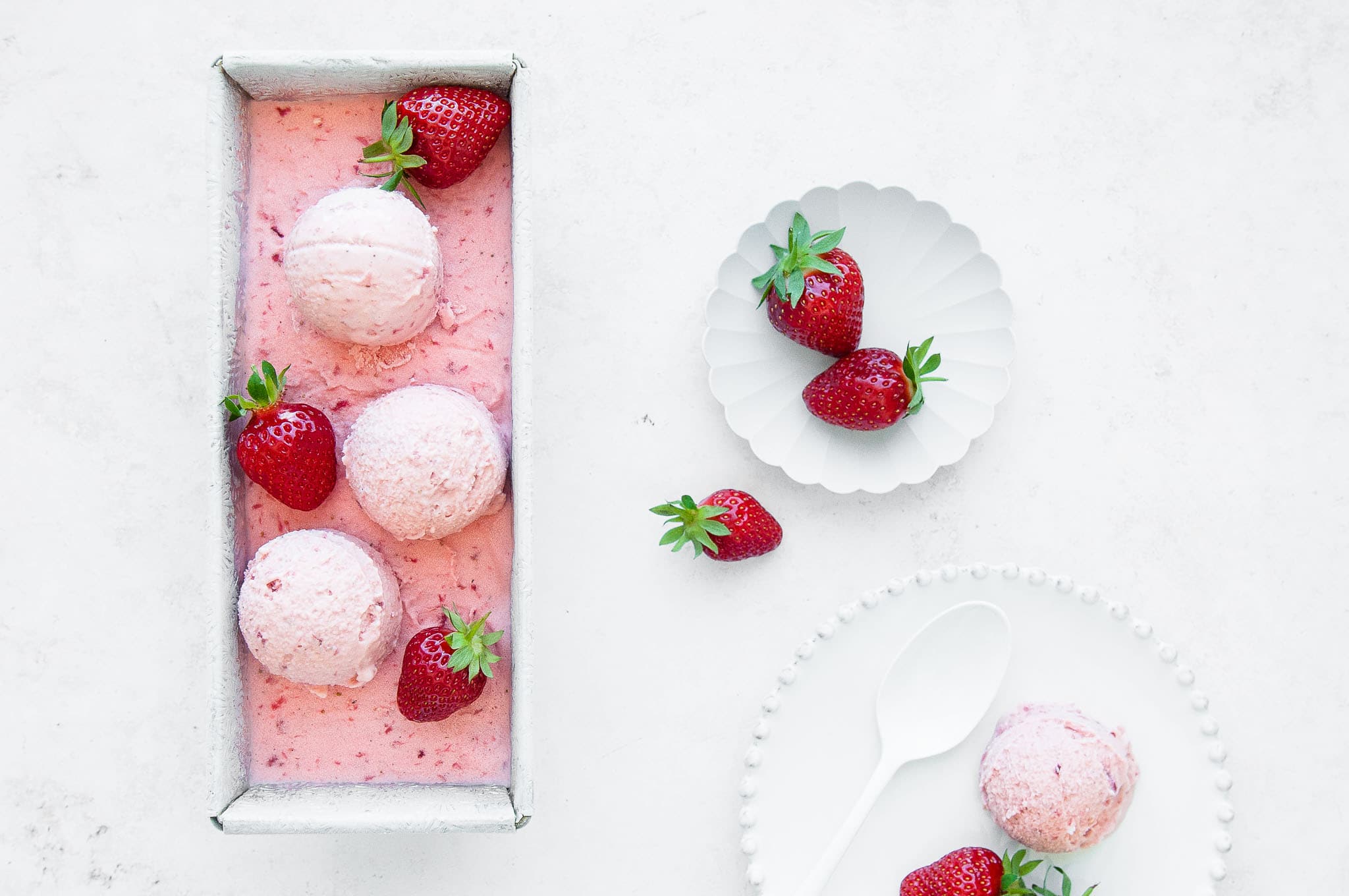 homemade strawberry ice cream with fresh strawberries