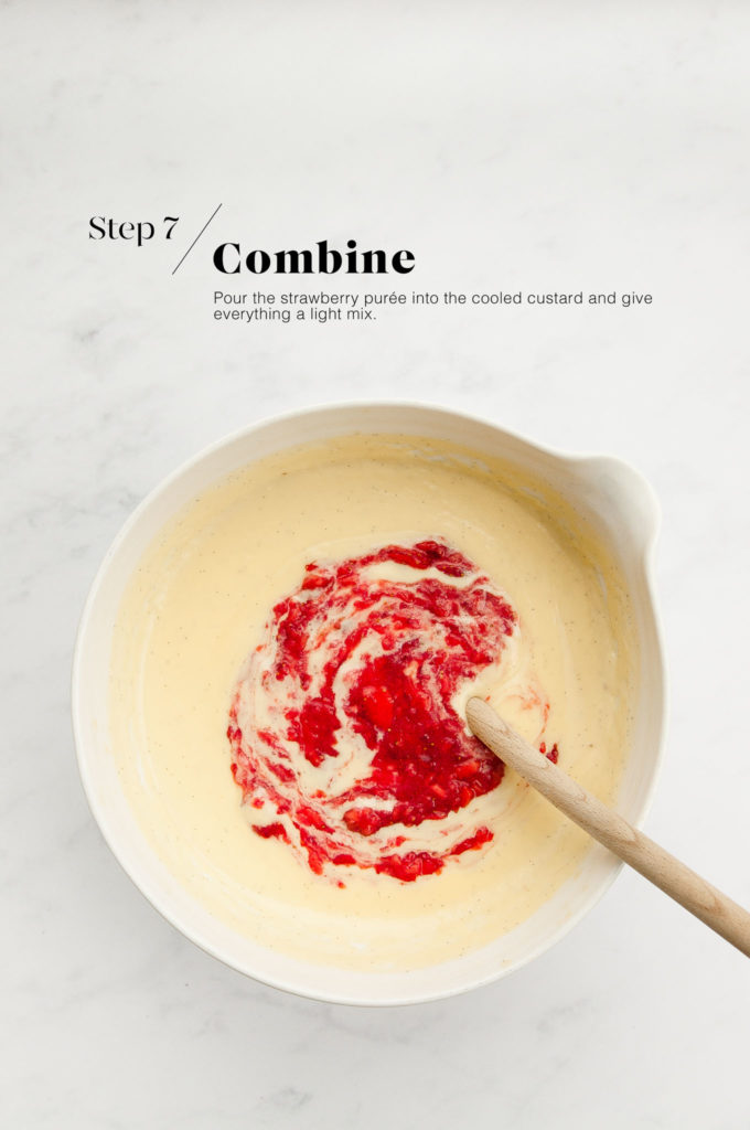 custard with strawberry puree in white mixing bowl